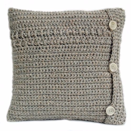 Hand crocheted cushion with woven detail