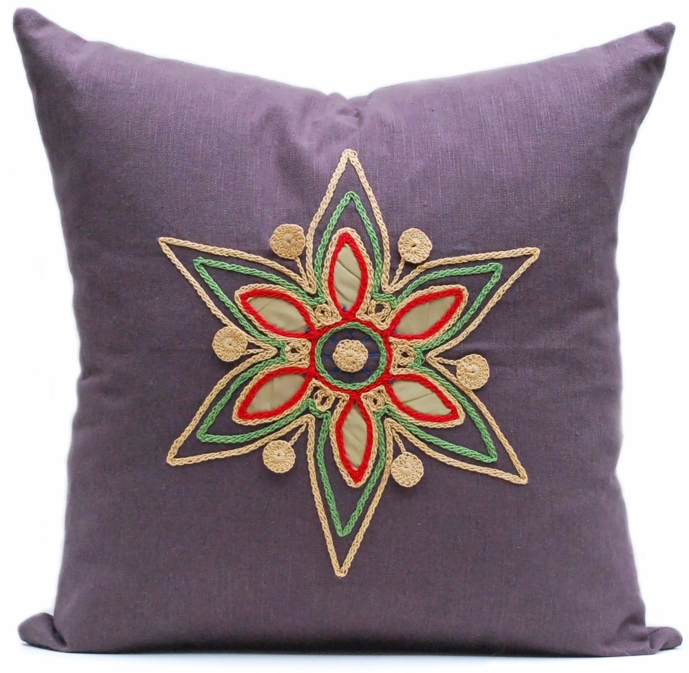 Dark linen cushion with gold floral star design 