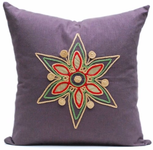Dark linen cushion with gold floral star design
