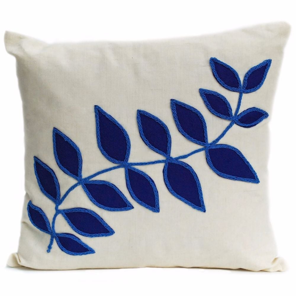 Linen cushion with blue leaf design