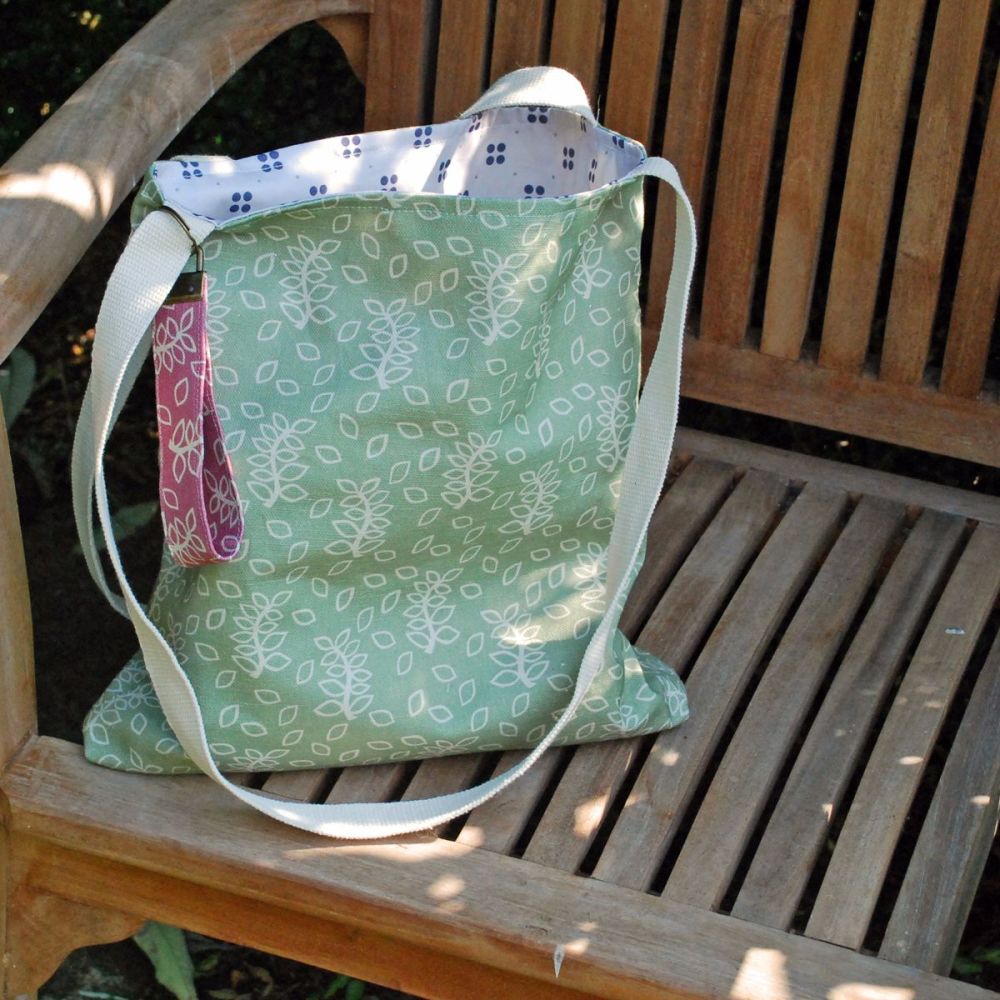 Sage green tote bag with leaves design