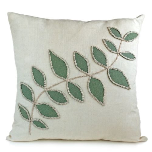 Linen cushion with sage green leaf design