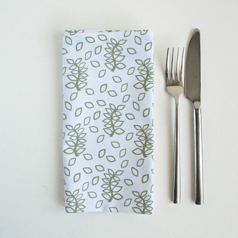 White napkins sage green leaves design
