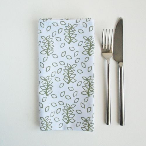 White napkins sage green leaves design