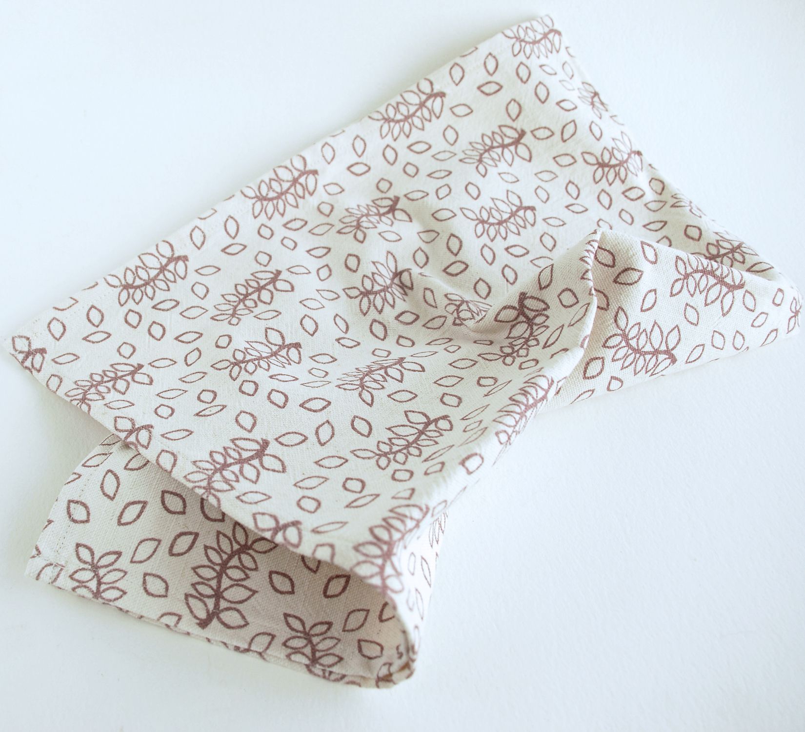 Linen union tea towel in antique rose leaves design