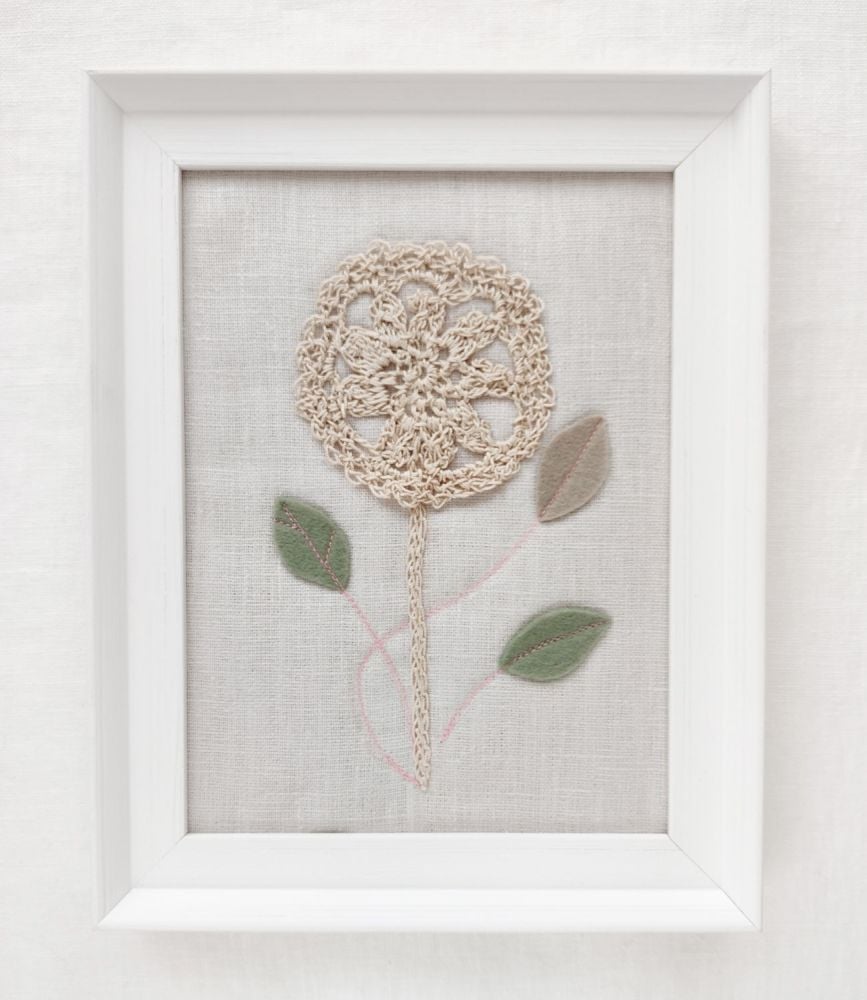 Framed crocheted flower textiles art on cloud linen