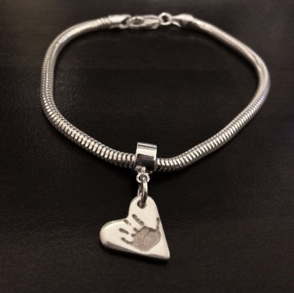 Charm on snake/pandora style bracelet