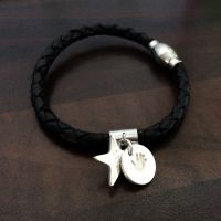 Charm on leather bracelet