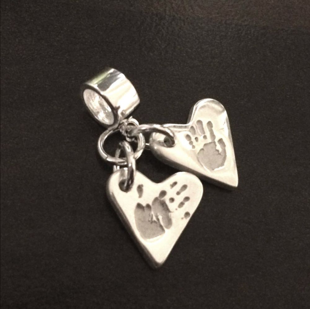 Charm on charm carrier or clasp