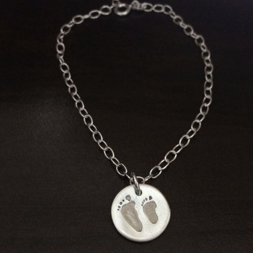 Charm on cable link bracelet