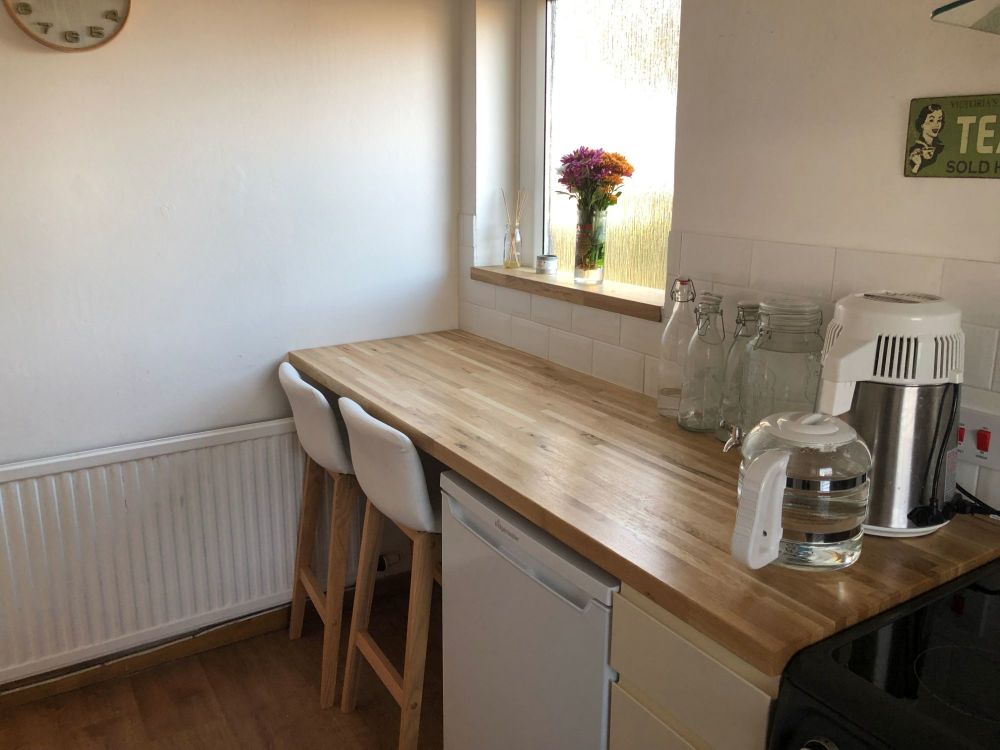 kitchen worktop and bar stool breakfast area to cover side door we never use