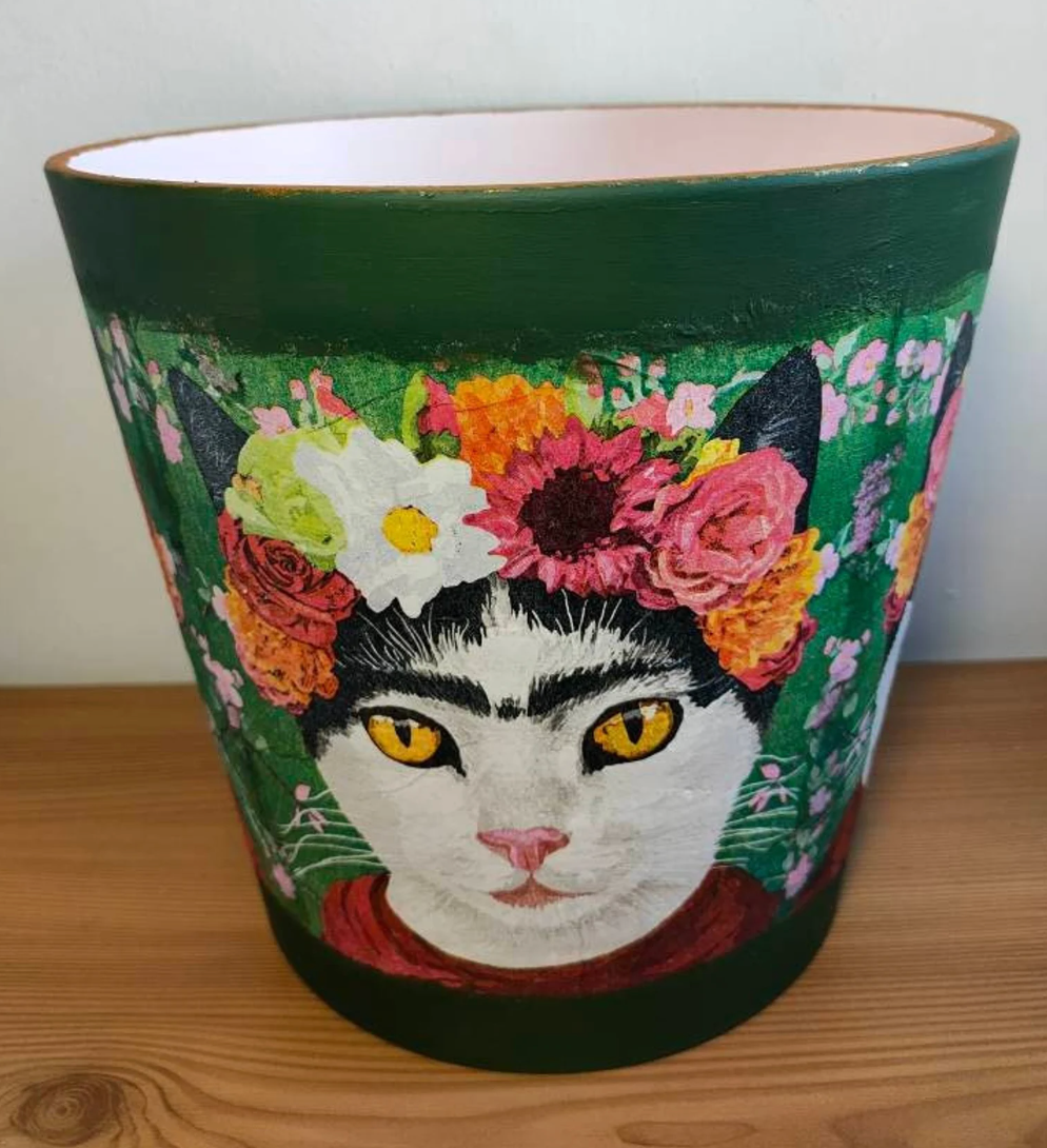 large plant pot painted with cat