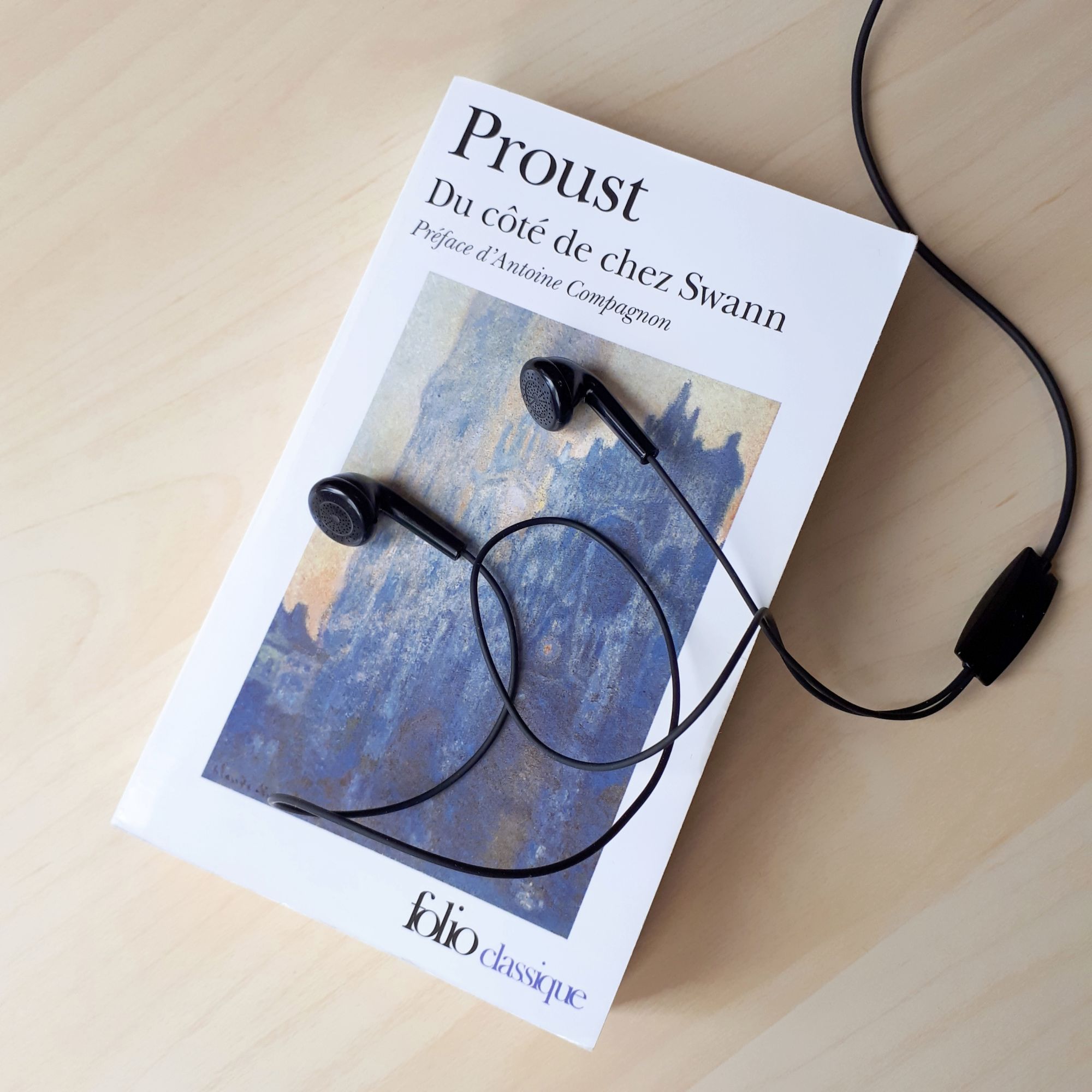 Proust novel and headphones