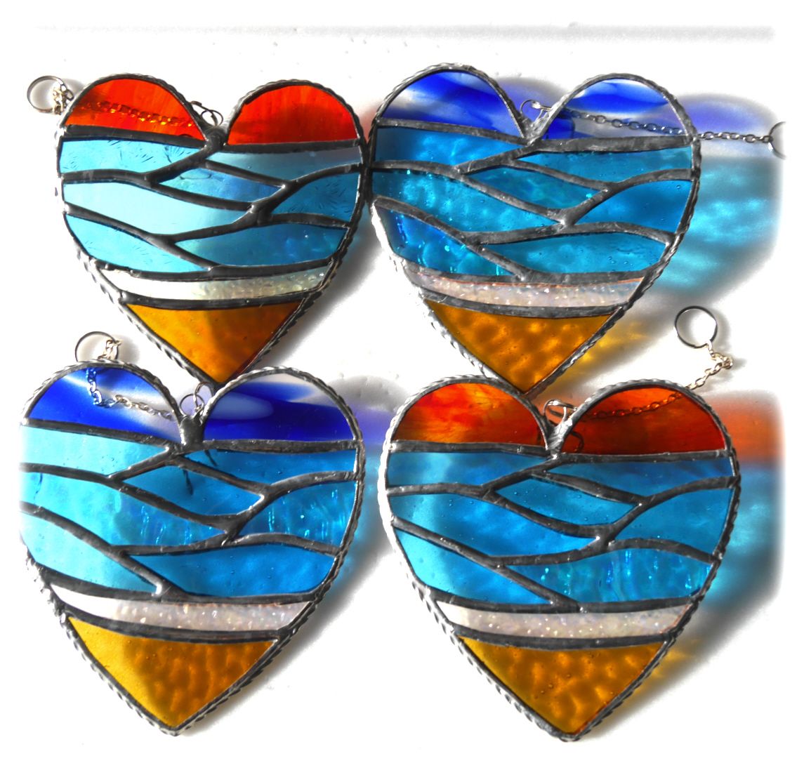 A Sea Heart Stained Glass Suncatcher Blue or Sunset Sky