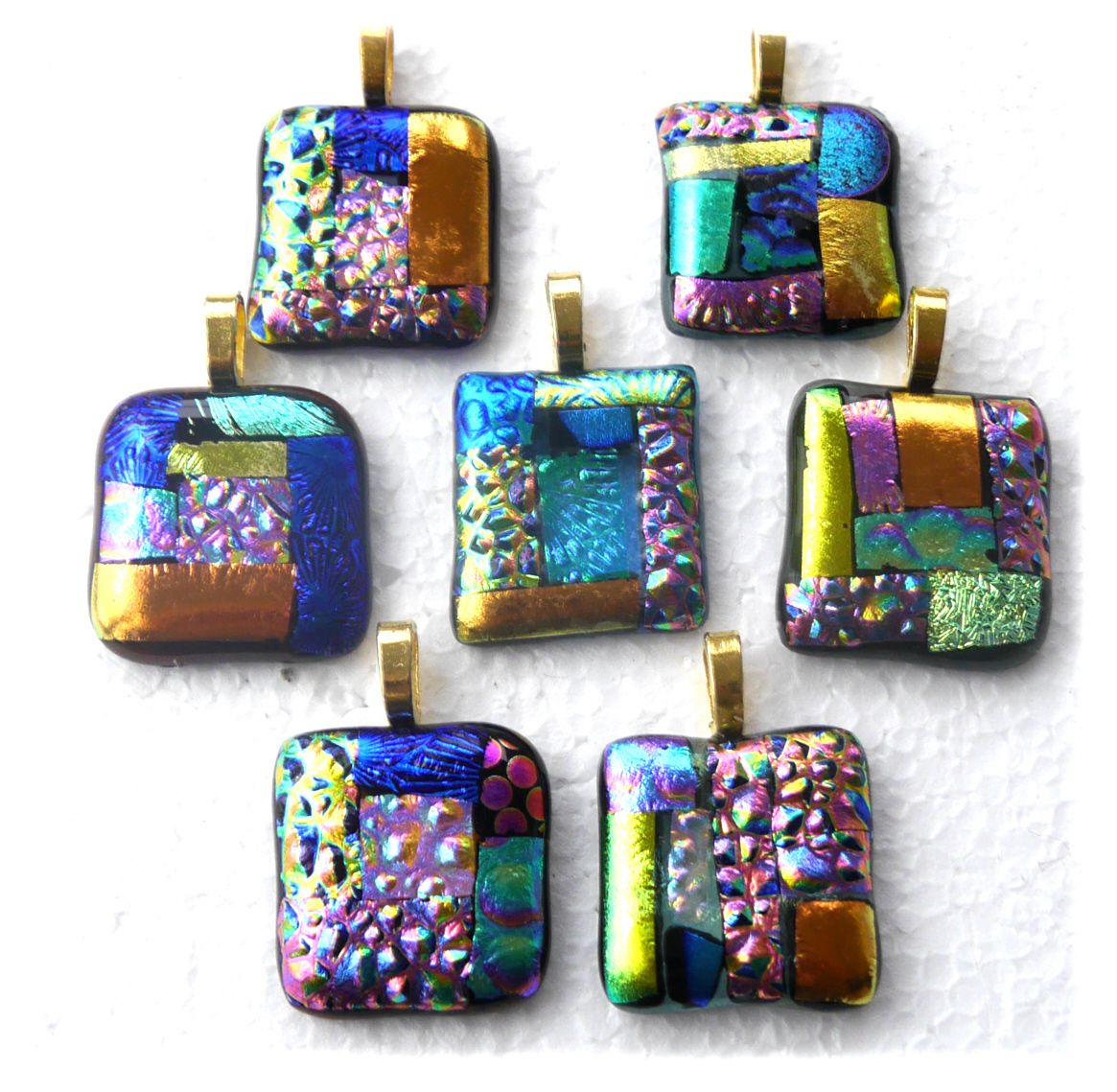 https://thebritishcrafthouse.co.uk/product/patchwork-dichroic-fused-glass-pendant-gold-chain-colour-choice/