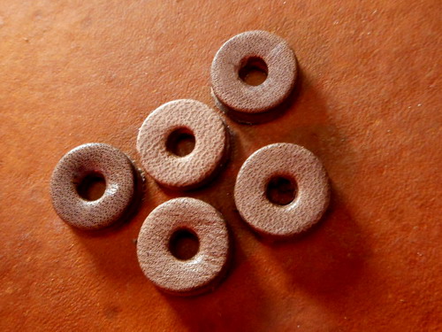 Fire-leather grommets for fire piston