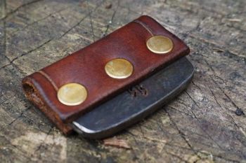 Fire and leather flint and steel striker with brass studs for beaver bushcr
