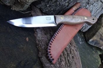 Cutting shark beaver bushcraft knife in dark russet with ferro rod and hand