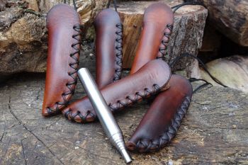 Leather &amp; Fire. New stubby fire storms with hand stitched leather sheaths b
