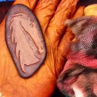 Beaver hand dyeing a key ring