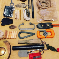 Prepper in the woods fire lighting edc with some items from from beaver bus