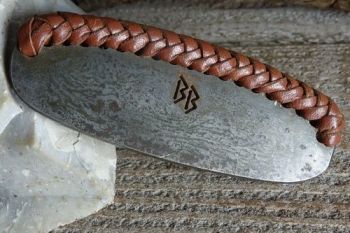 Fire steel with hand laced leather edge for beaver bushcraft