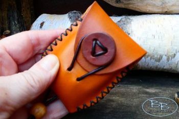 Fire lighting hand sized leather tinderpouch hand stitched by beaver bushcr