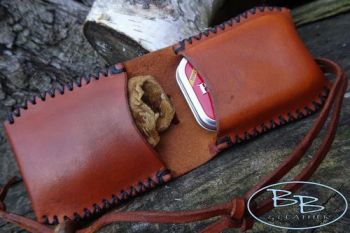 Fire and leather funky pioneering pouch made by beaver bushcraft