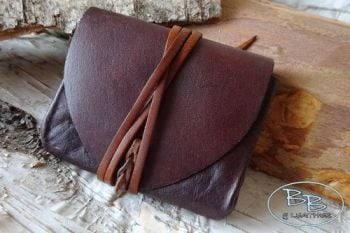 Leather vintage pouch with simple fire steel by beaver bushcraft