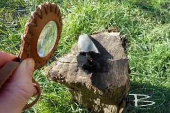 leather and fire solar pendant in action by beaver bushcraft