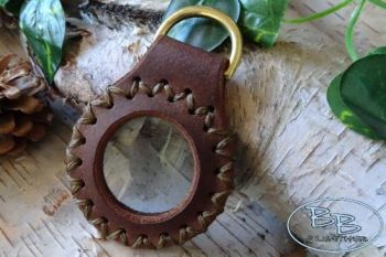 Leather solar pendant with brass D ring for fire lighting by beaver bushcra