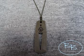 fire steel pendant with tiskele detail worn by beaver bushcraft