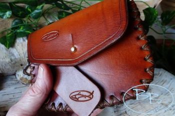Leather hand dyed leather gussetted pouch with cross stitch made by beaver