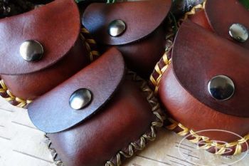 Learher pouches and purses and stitched by beaver bushcraft