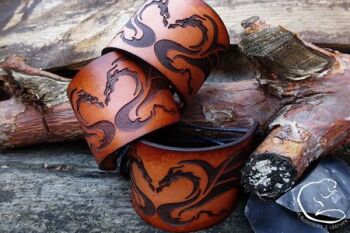 Cuffs of viking kissing dragons in ombre