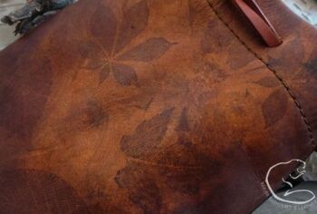 Leather pouch with hand printed design