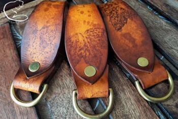 Leather belt loop in leaves of autumned ghosted effcet by beaver bushcraft Leather belt loop in leaves of autumned ghosted effcet by beaver bushcraft