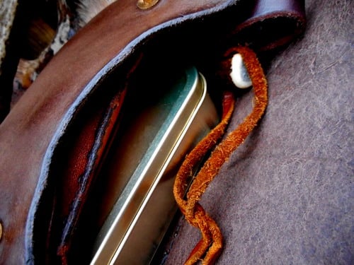 leather-hard medium-hand stitched pouch-brown- close up with contents