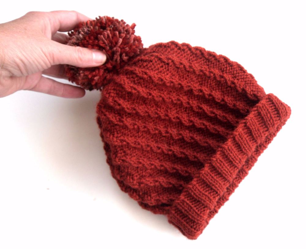 Rust Red knitted hat with pom pom