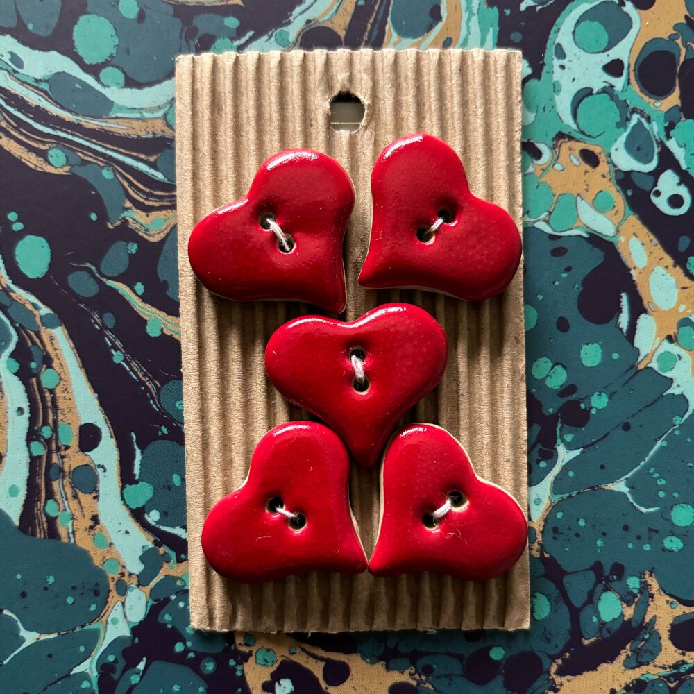 Red shiny heart buttons -