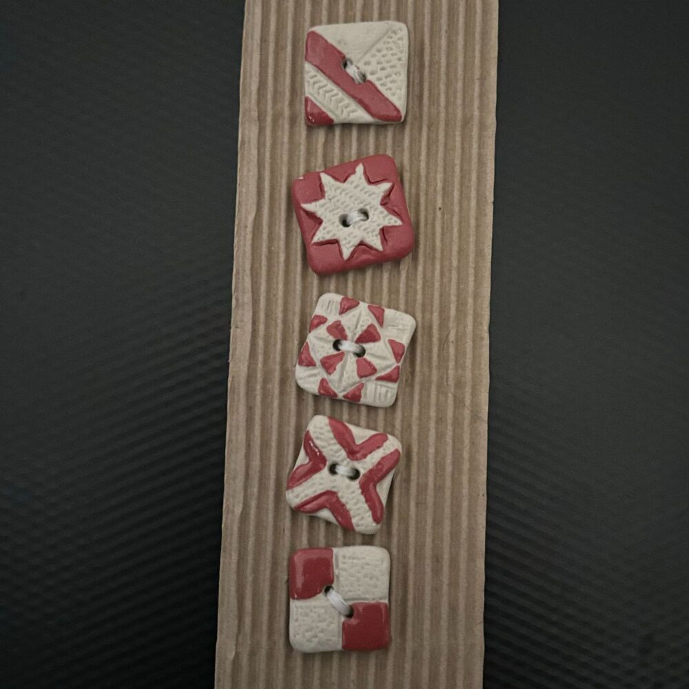 Red and white square buttons