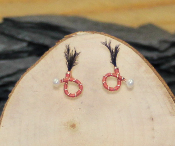Pink body black feather round nymph earrings