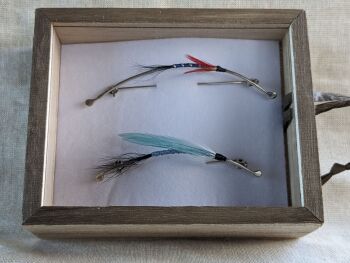 Fly tying brooch collection