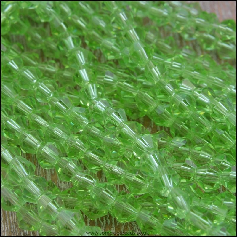 4mm Peridot Green Faceted Glass Bicone Beads.