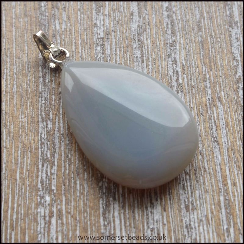Teardrop shaped grey agate gemstone pendant with silver plain bail