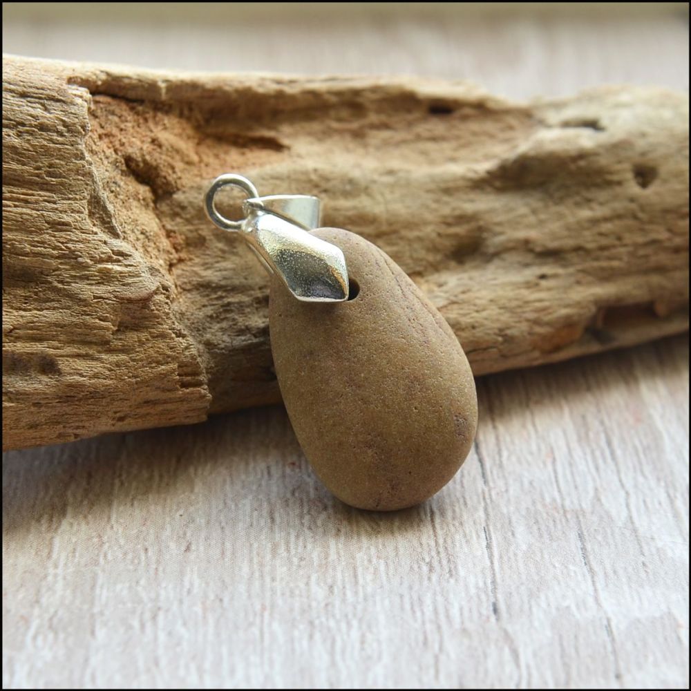 light coloured oval cornish beach pebble pendant with silver bail