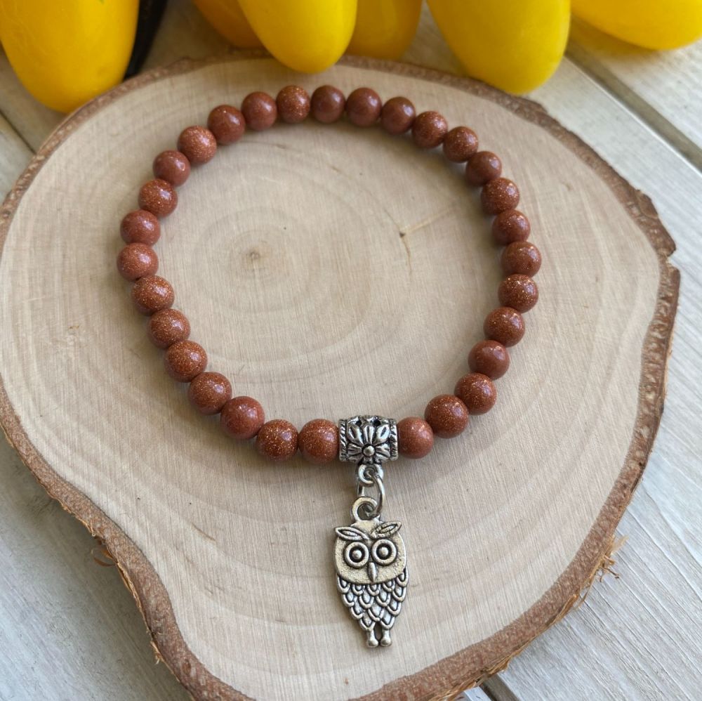Crystal Bracelet with Goldstone Beads and a Owl Charm