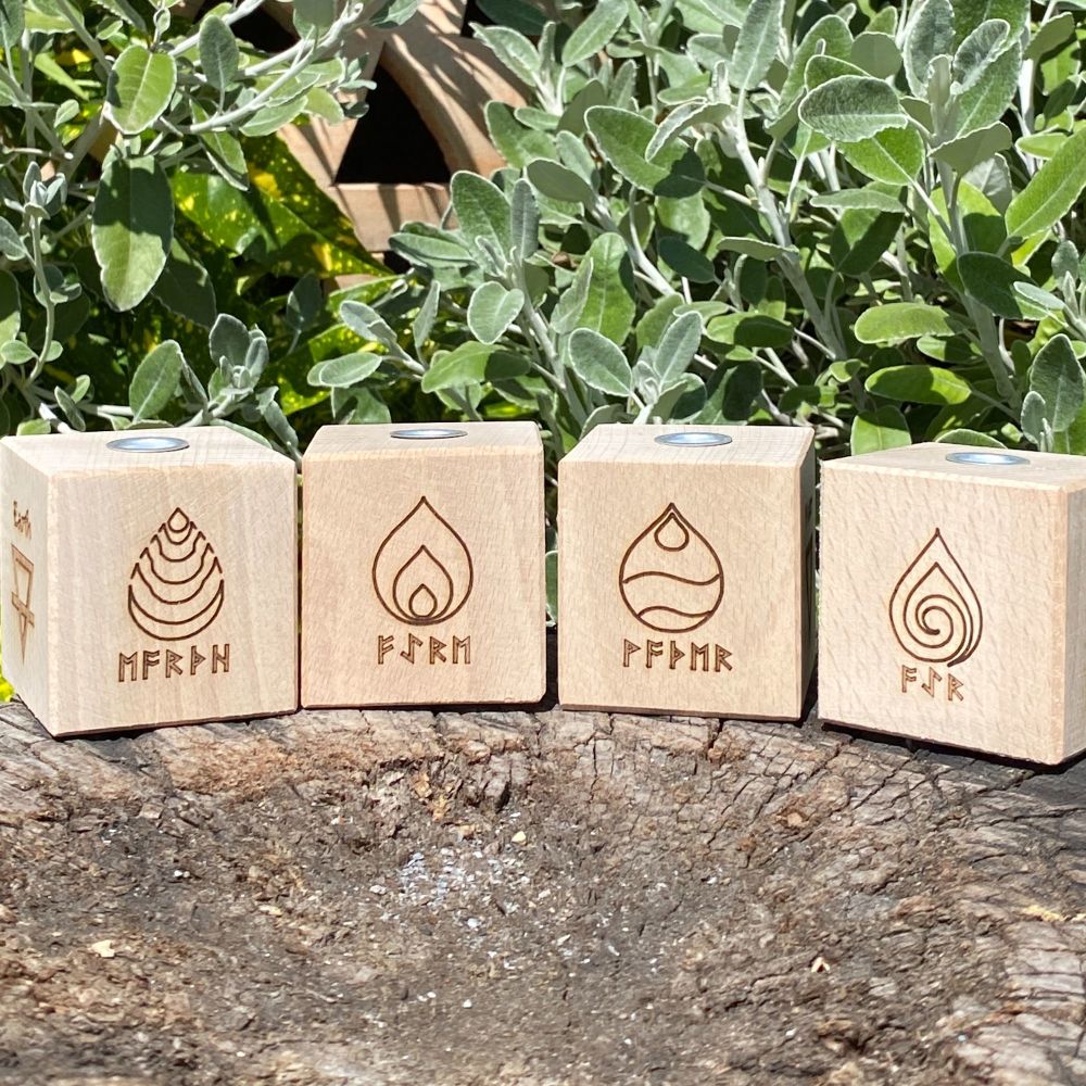 A Set of four Handcrafted Wood Candle Holder with Elements symbols on each one