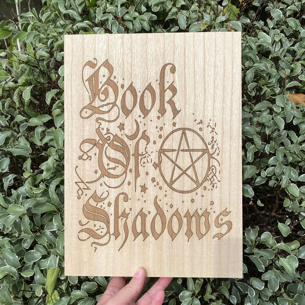 A Wooden Storage Box with Book of Shadows on the lid