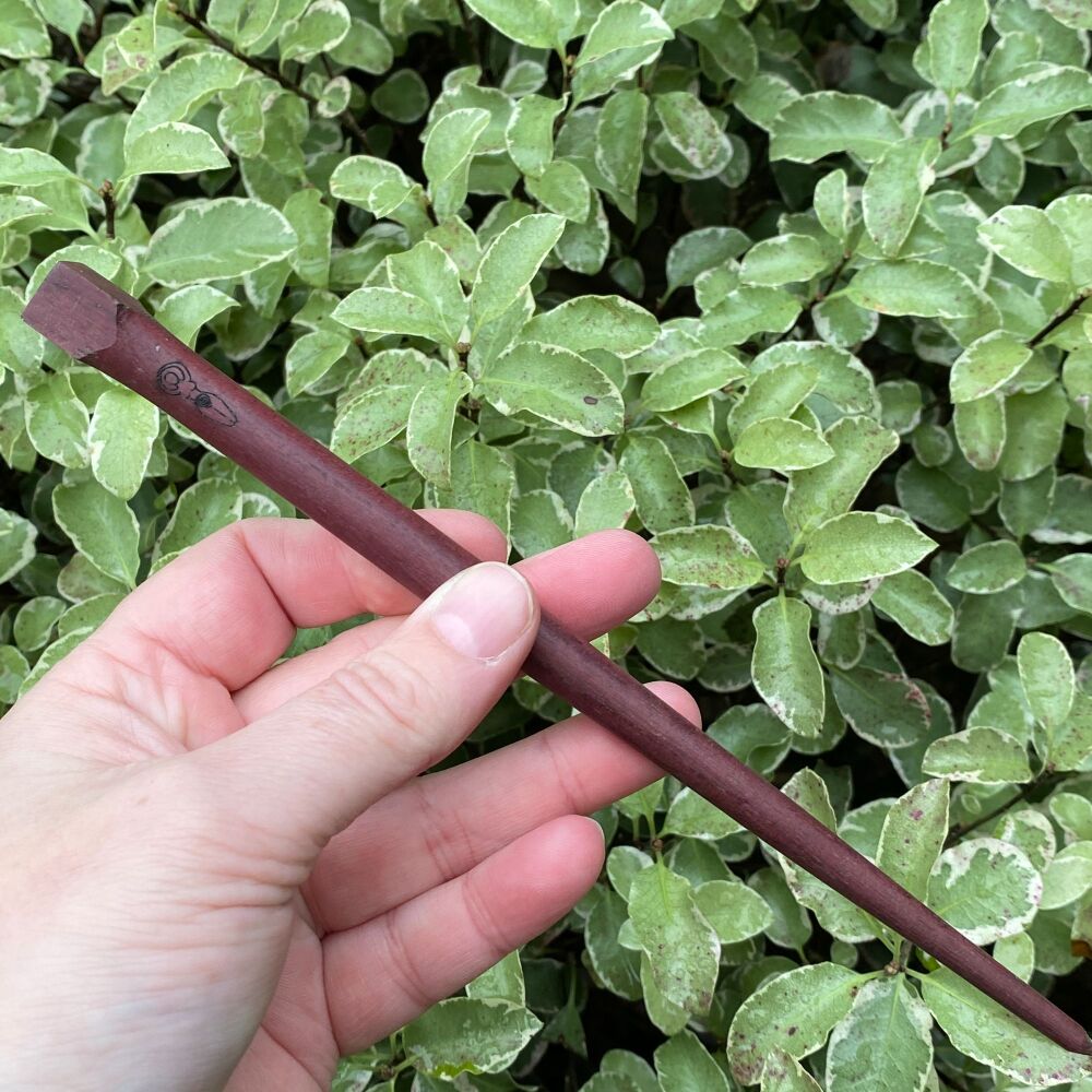 A stunning hand crafted wooden wand with a little Goddess symbol engraved